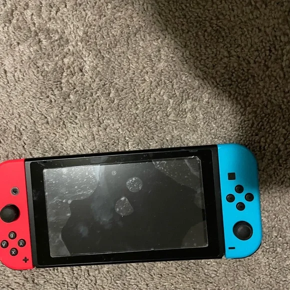 Nintendo Switch Handheld Console with Black Accessories